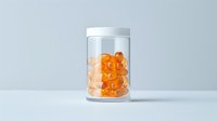 Transparent jar filled with bright orange spherical supplements or fish oil capsules against minimalist light blue background.