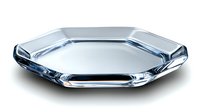 Octagonal crystal glass plate with beveled edges and reflective surface on white background, isolated luxury tableware for elegant dining and home decor styling.