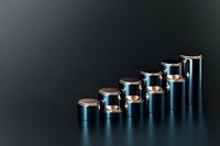 Metallic blue and gold cylinders arranged in ascending staircase formation on reflective dark surface, representing growth, progress and business success.