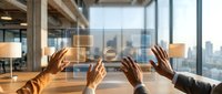 Multiple hands touching transparent digital interface with holographic icons above wooden table in modern office with city skyline view, representing teamwork, technology collaboration, and business innovation.