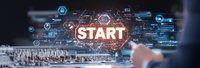 Businessman pointing at glowing START button with digital network interface and technology icons for business launch and entrepreneurship concepts.