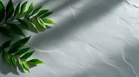 Fresh green fern leaves on textured white marble surface with soft shadows, creating minimal natural composition for wellness and spa backgrounds.
