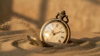 Vintage pocket watch partially buried in golden sand with warm sunlight creating dramatic shadows and highlighting intricate details of timepiece.
