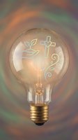 Vintage light bulb with glowing religious symbols including cross, plant sprout and decorative swirls against colorful rainbow background for spiritual concepts.