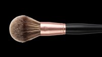 Makeup brush with natural bristles, rose gold ferrule and black handle isolated on transparent background, ready for beauty product design, clipart, sublimation and print-on-demand applications.