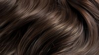Luxurious brown hair with natural highlights flowing in smooth waves, showcasing healthy shine and silky texture for beauty and haircare concepts.