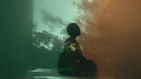 Silhouette of person meditating in lotus position against dramatic wall shadows, creating atmospheric mood with teal and orange gradient lighting.
