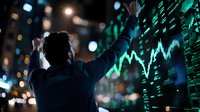 Young Asian businessman analyzing digital stock market data on futuristic curved display with glowing green charts and financial graphs at night.