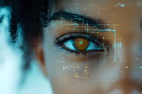 Close up of brown eye with digital interface overlay showing biometric scanning and data analysis elements against dark skin tone background.