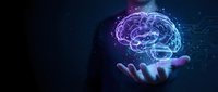 Glowing digital brain hologram floating above open palm against dark background with neural network connections and light particles for AI technology concepts.