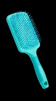 Turquoise paddle hair brush isolated on transparent background, ready for beauty, salon, and grooming design projects, t-shirts, clipart, and print-on-demand products.