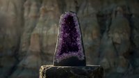 Amethyst geode cathedral with deep purple crystals on a rocky surface, dramatic stone background, natural mineral specimen for decor.