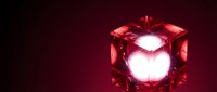 Glowing red crystal cube with bright white light core on dark background, suitable for technology, energy, and abstract design projects.