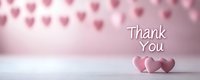 Pink heart decorations and text saying Thank You on soft blurred background with two heart shapes in foreground creating romantic appreciation scene.
