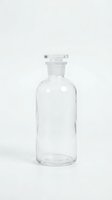 Empty clear glass bottle with cork stopper isolated on white background for product design and packaging mockups.