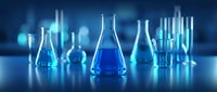 Laboratory glassware with blue liquid in modern scientific research facility. Chemistry equipment for experiments and analysis in medical lab.
