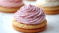 Pink frosted cookie with sprinkles on golden baked base, sweet dessert treat for bakery menu, party celebration or food blog content.