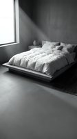 Minimalist bedroom interior with platform bed, white linens, and natural light from window in monochromatic space. Ideal for home decor, interior design, and lifestyle content.