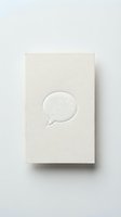 Cream textured card with embossed speech bubble symbol, isolated on white background for greeting card design, stationery, communication concept, and branding applications.