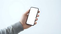 Hand holding smartphone with blank white screen against neutral background, suitable for app mockups, mobile technology presentations, and digital marketing materials.