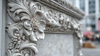 Ornate stone carving with floral and acanthus leaf motifs on classical building facade, showcasing detailed architectural craftsmanship in urban setting.