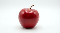 Fresh red apple with stem isolated on white background, suitable for food, nutrition, health, and wellness design projects.