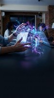 Hands creating magical energy with glowing purple and blue light effects in modern office space for digital transformation and innovation concepts.