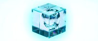 Transparent cyan ice cube with frozen water droplet suspended inside, isolated on white background for design and commercial use.