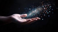 Hand releasing magical glowing particles and light dust against dark background, creating ethereal effect for fantasy or spiritual concepts.