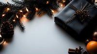 Elegant black wrapped gift with pine branches, glowing string lights, orange citrus and cinnamon sticks on white background. Festive winter holiday composition.