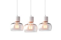 Modern pendant lights with glass shades and white metal fixtures, featuring warm glowing Edison bulbs against white background, isolated for interior design projects.