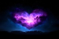Mystical heart-shaped nebula glowing in vibrant purple and blue colors against dark night sky, with silhouetted landscape below creating romantic cosmic scenery.