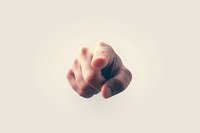 Pointing finger gesture on light background, dramatic lighting creates mysterious atmosphere. Isolated hand shows accusatory or choosing motion.