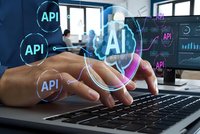 Software developer typing on laptop with AI and API interface icons overlay in modern office environment for technology programming projects.