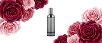 Metallic spray bottle surrounded by pink and red roses on white background, suitable for cosmetics, perfume, skincare product marketing and beauty advertising.