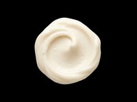 Creamy white swirl of cosmetic cream or frosting isolated on transparent background, ready for stickers, print on demand, T-shirt design, and clipart use.