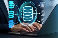 Business professional managing database systems with glowing data storage icons and analytics charts on laptop for technology and data management solutions.