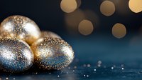 Festive golden Easter eggs decorated with glitter and sparkles on dark blue background with bokeh lights creating magical holiday atmosphere.