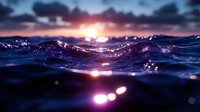Ocean waves at sunset with dramatic sky and water reflections creating magical seascape atmosphere for nature and travel content.