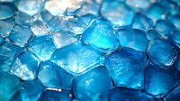 Glowing blue ice cubes with crystalline structure in macro photography, cold frozen water fragments with light illumination creating abstract geometric pattern.