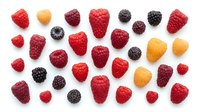 Fresh mixed berries collection with strawberries, raspberries, blackberries and golden berries isolated on white background for healthy eating concepts.