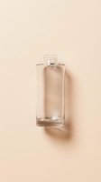 Clear glass bottle with transparent liquid on neutral beige background, isolated for cosmetics, skincare, perfume, or beauty product packaging design and branding mockups.