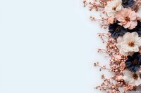 Elegant floral border with navy blue and blush pink flowers arranged on white background, featuring delicate branches and blooms in modern composition.
