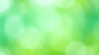 Soft green bokeh background with blurred light circles, suitable for web design, presentations, and digital marketing materials.