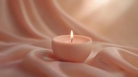 Glowing tea light candle on soft pink silk fabric creating peaceful ambiance with gentle folds and warm illumination. Minimalist composition for spa and wellness.