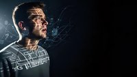 Young Caucasian man with futuristic digital network connections and glowing data streams around his head on dark background for technology concepts.