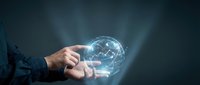 Businessman hands holding glowing digital brain with network connections representing artificial intelligence and machine learning technology concepts.