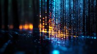 Digital matrix rain with glowing orange and blue light streams falling against dark background, creating futuristic cybersecurity visualization effect.