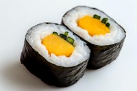 Fresh mango sushi rolls with rice and nori seaweed wrap on white background, close-up view showing vibrant orange fruit filling and green garnish.