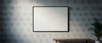 Minimalist interior with blank black frame on textured gray wall, wooden bench, and green plant, mockup for art print or poster display.